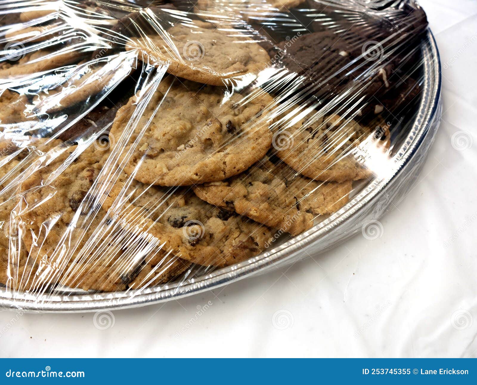 Cookies on Plate Under Plastic Wrap for Fresh Dessert Stock Image