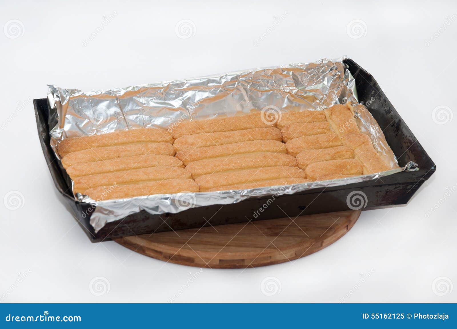 Cookies Submerged in Milk and Arranged in a Baking Dish Stock Image
