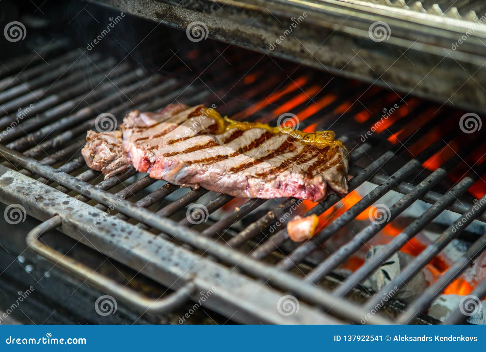 Cooking Beef Steak on a Barbecue Grill. Restaurant, Chef. Open Fire