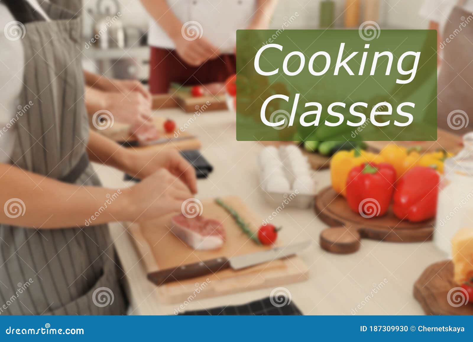 Cooking Classes. Blurred View of People Preparing Meat in Kitchen Stock