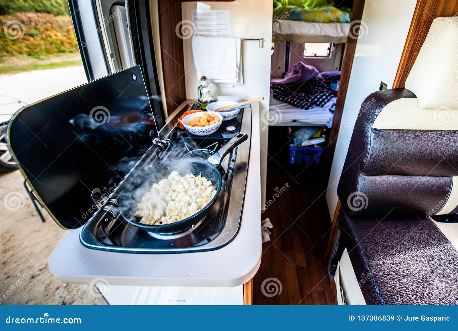 https://thumbs.dreamstime.com/z/cooking-dinner-lunch-campervan-motorhome-rv-cooking-dinner-lunch-campervan-motorhome-rv-preparing-chicken-137306839.jpg