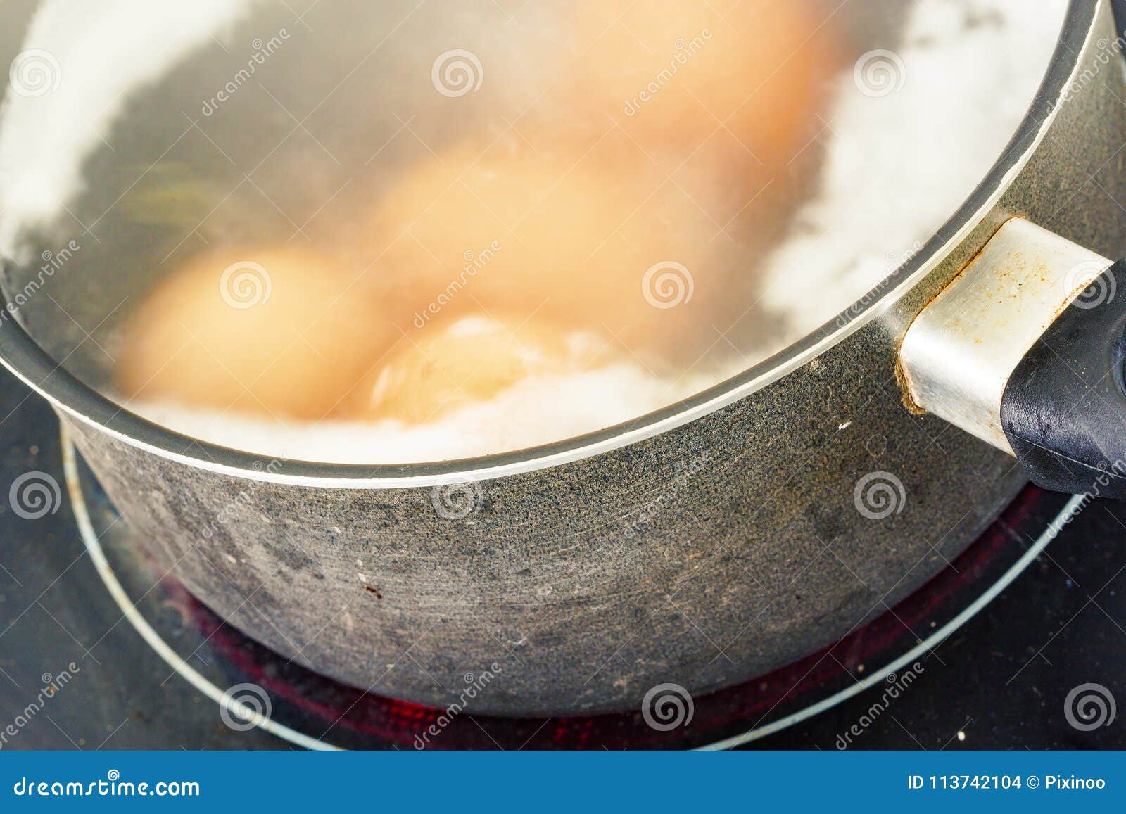 Cooking Eggs in a Pot of Water on a Ceramic Hob Stock Photo Image of