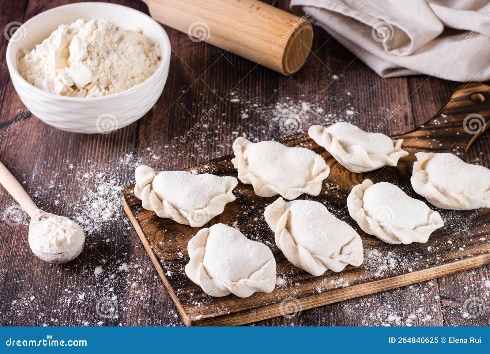 Cooking Homemade Dumplings. Raw Dumplings on the Board and Flour Stock