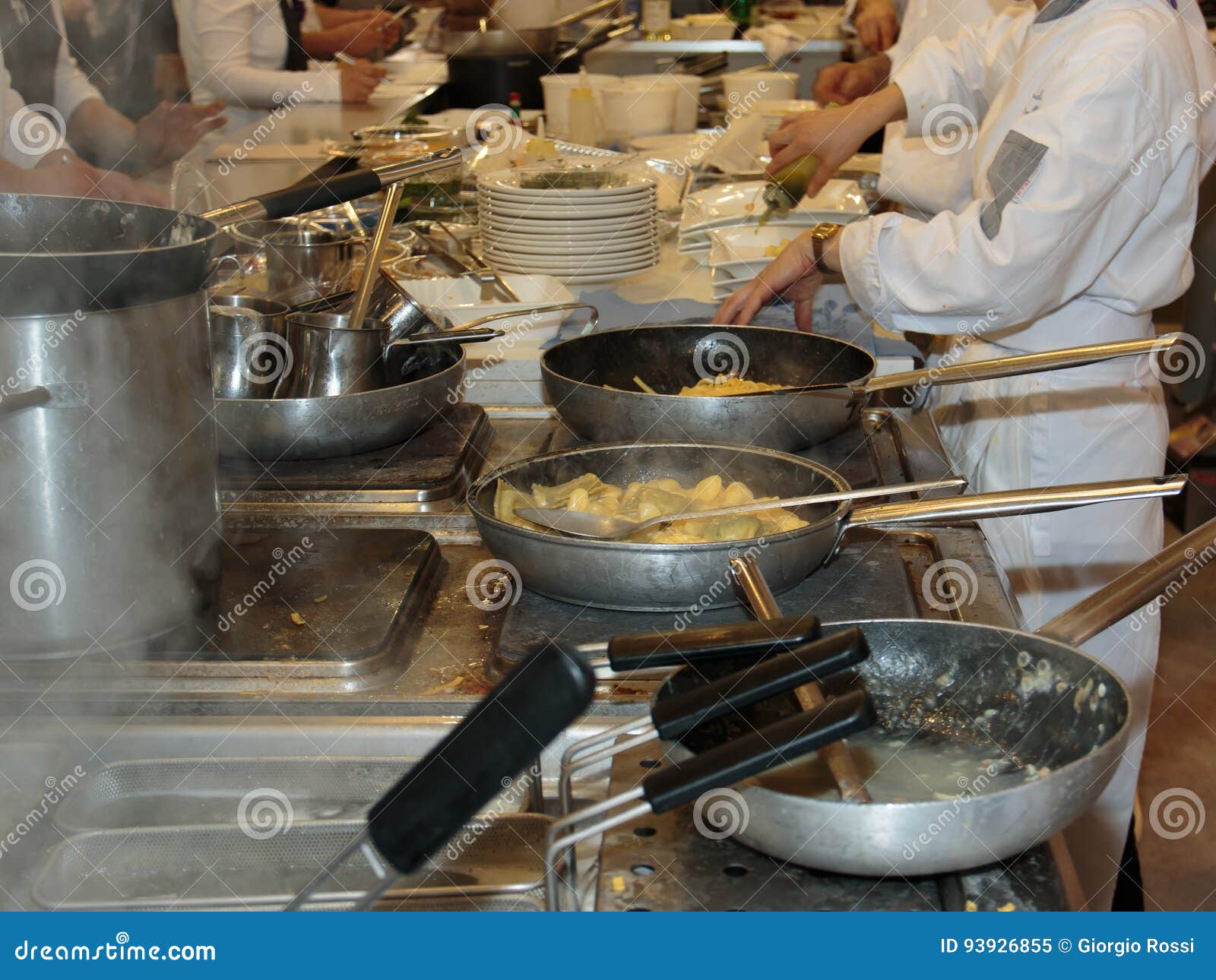 Cooking Inside Restaurant& X27;s Kitchen, Pans and Chef with Uniform