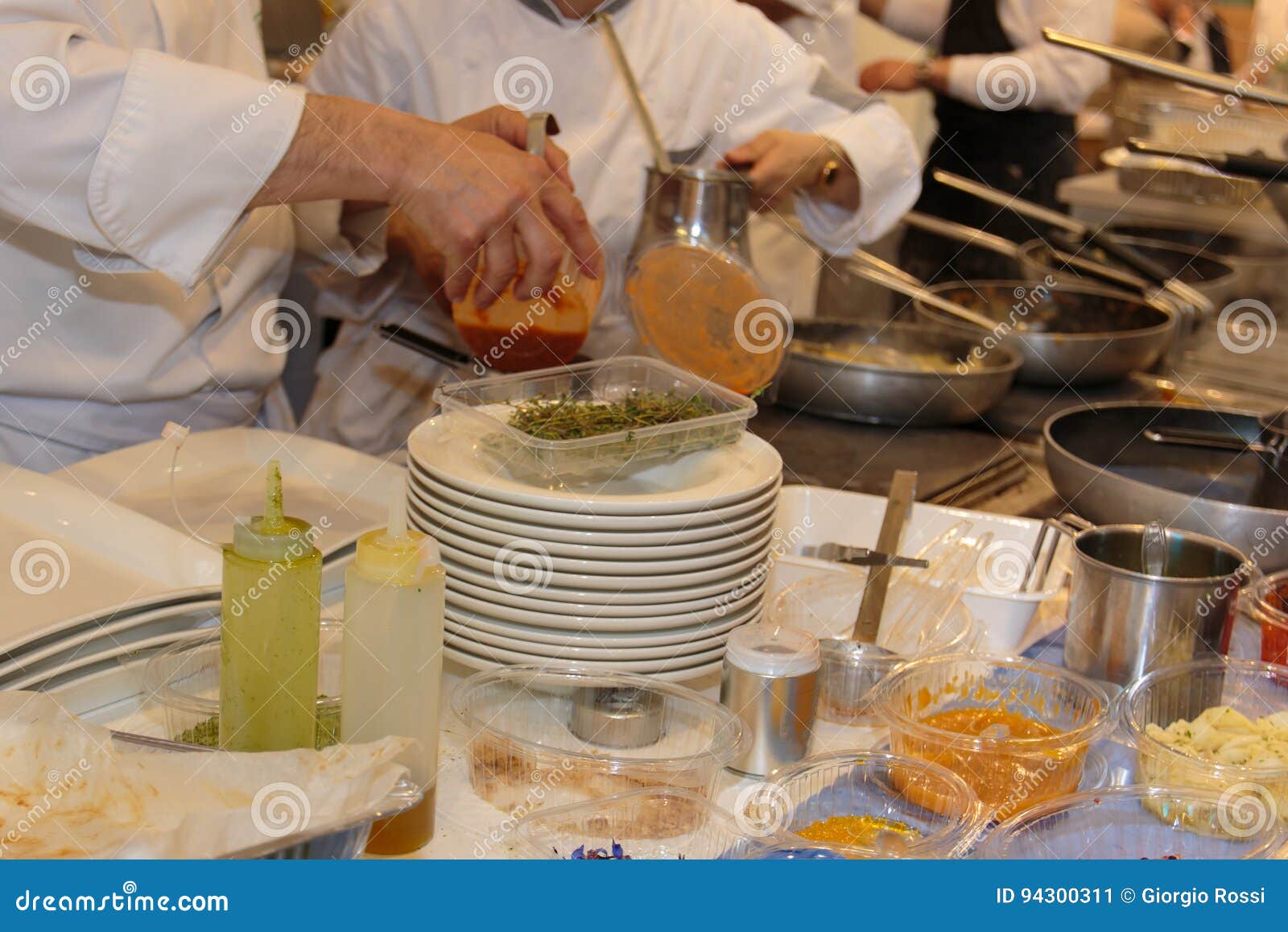 Cooking Inside Restaurant& X27;s Kitchen, Pans and Chef with Uniform