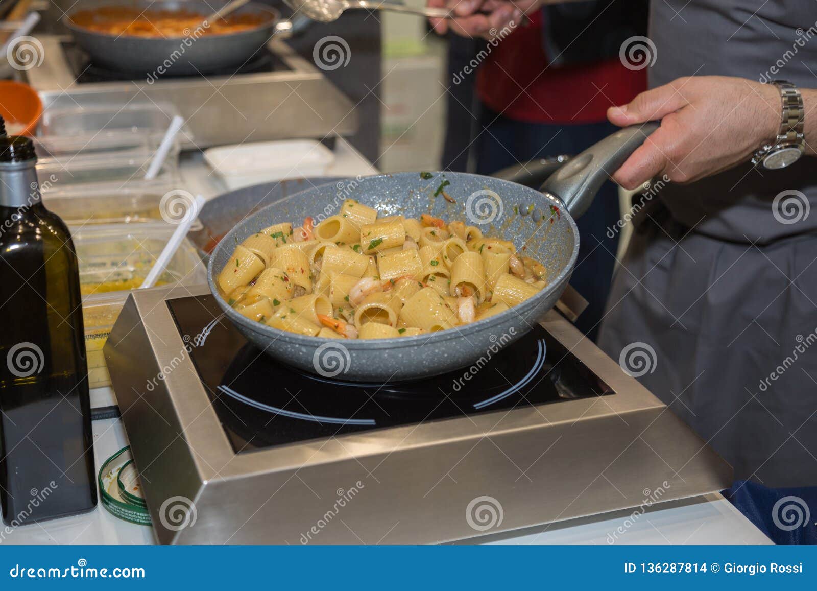 Cooking Italian Pasta Inside Saucepan Chef at Work in the Kitchen