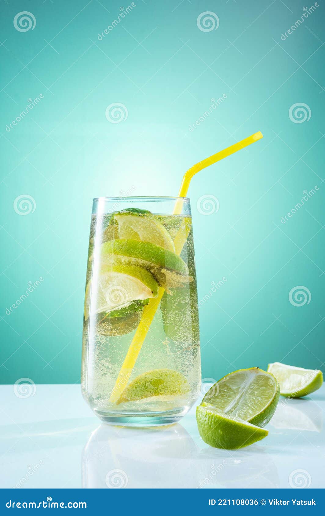 Cooking Lemonade in a Glass and a Straw. Bright Light Composition