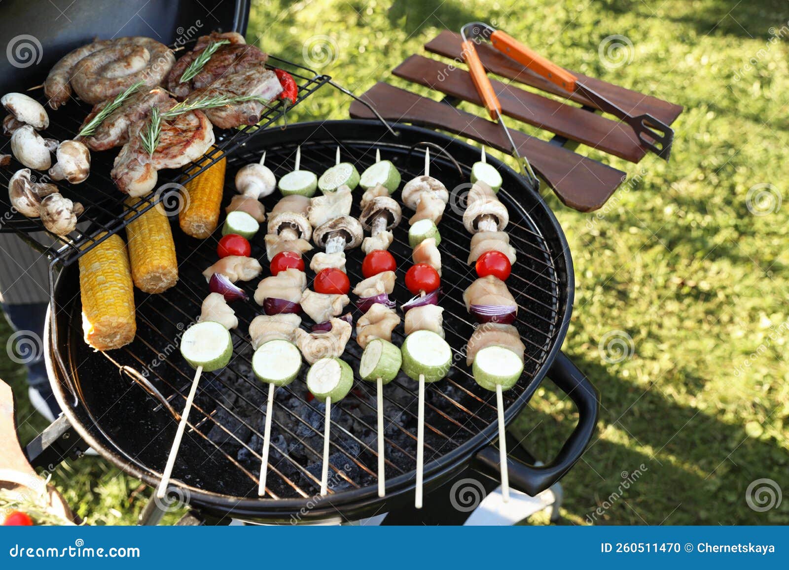 Cooking Meat and Vegetables on Barbecue Grill Outdoors Stock Photo