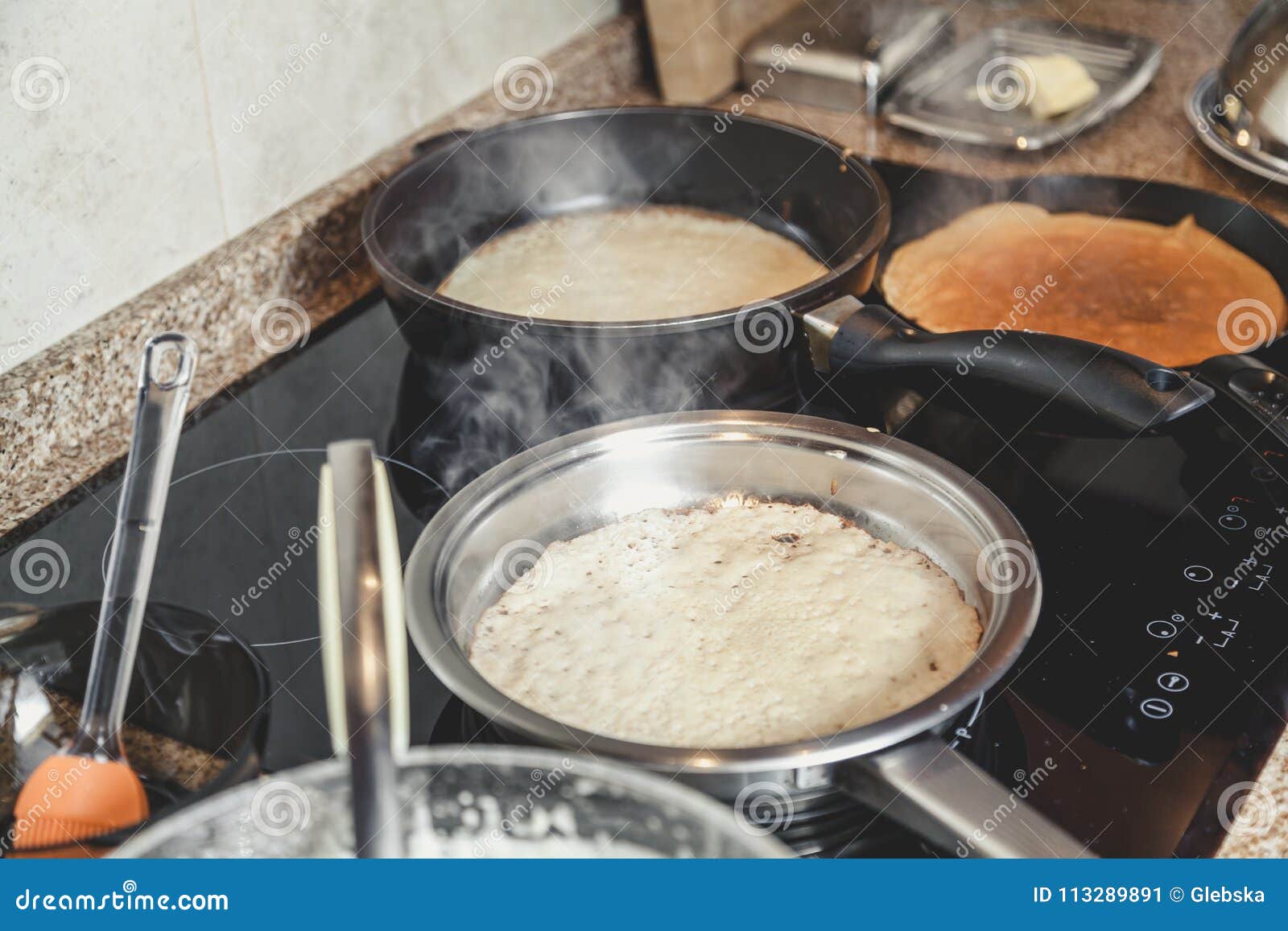 Cooking Pancakes in Several Pans Stock Image Image of dish, modern