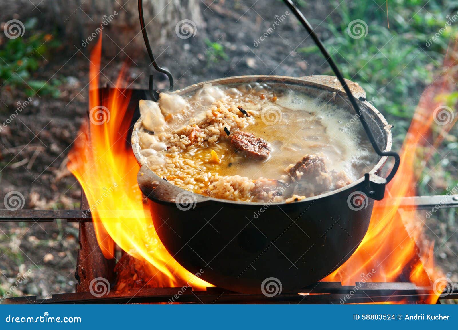 Cooking Pilaf in a Casserole on the Fire Close Up Stock Photo Image