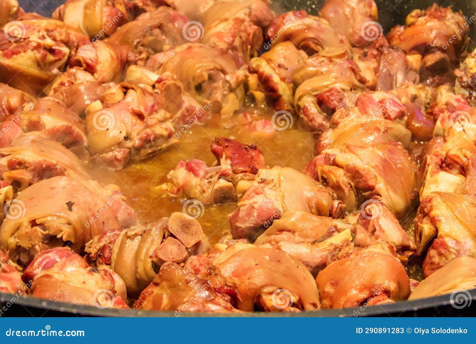 Cooking of Pork Knuckle (traditional German Dish) in Big Cauldron Stock