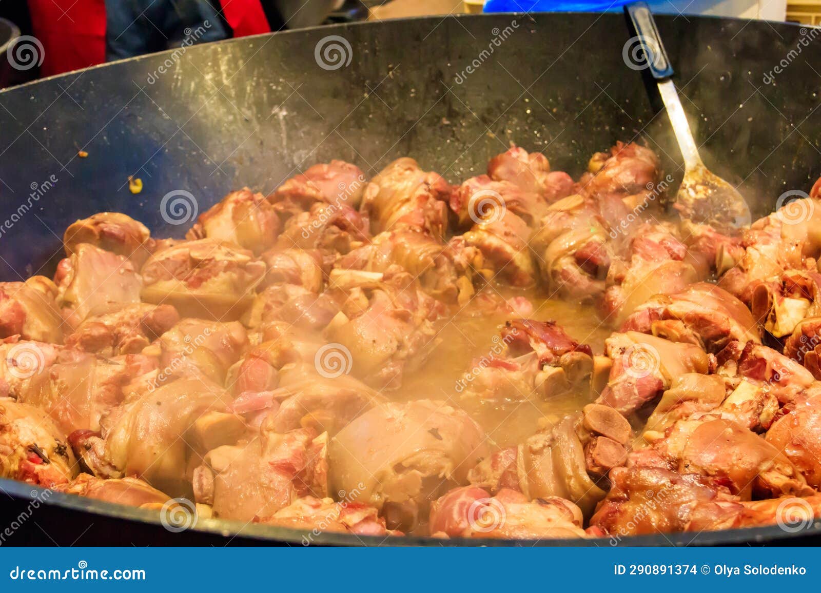 Cooking of Pork Knuckle (traditional German Dish) in Big Cauldron Stock