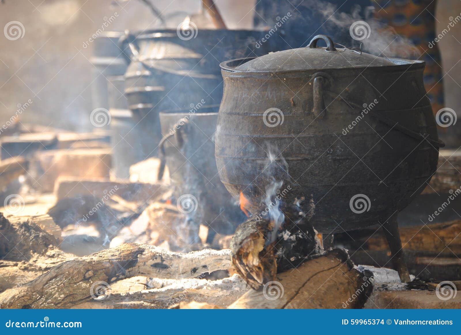 Cooking pots on a fire stock photo. Image of campfire 59965374