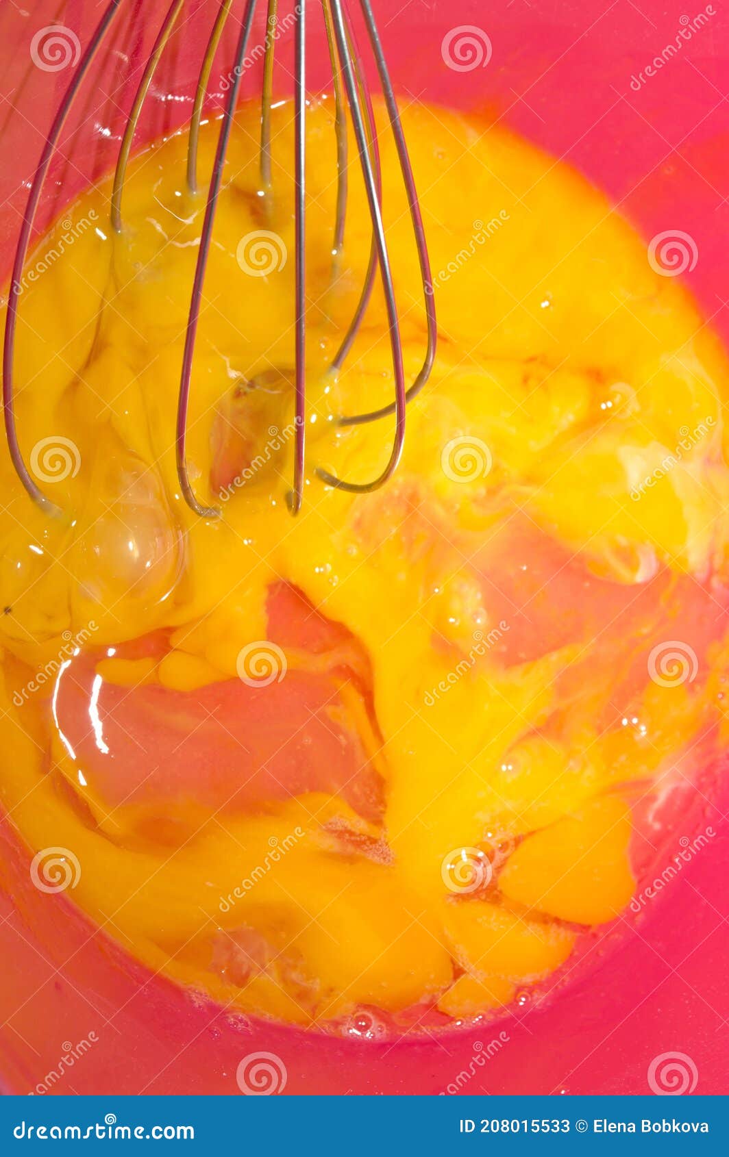 The Cooking Process. in a Red Bowl, Beat the Eggs with a Whisk Stock