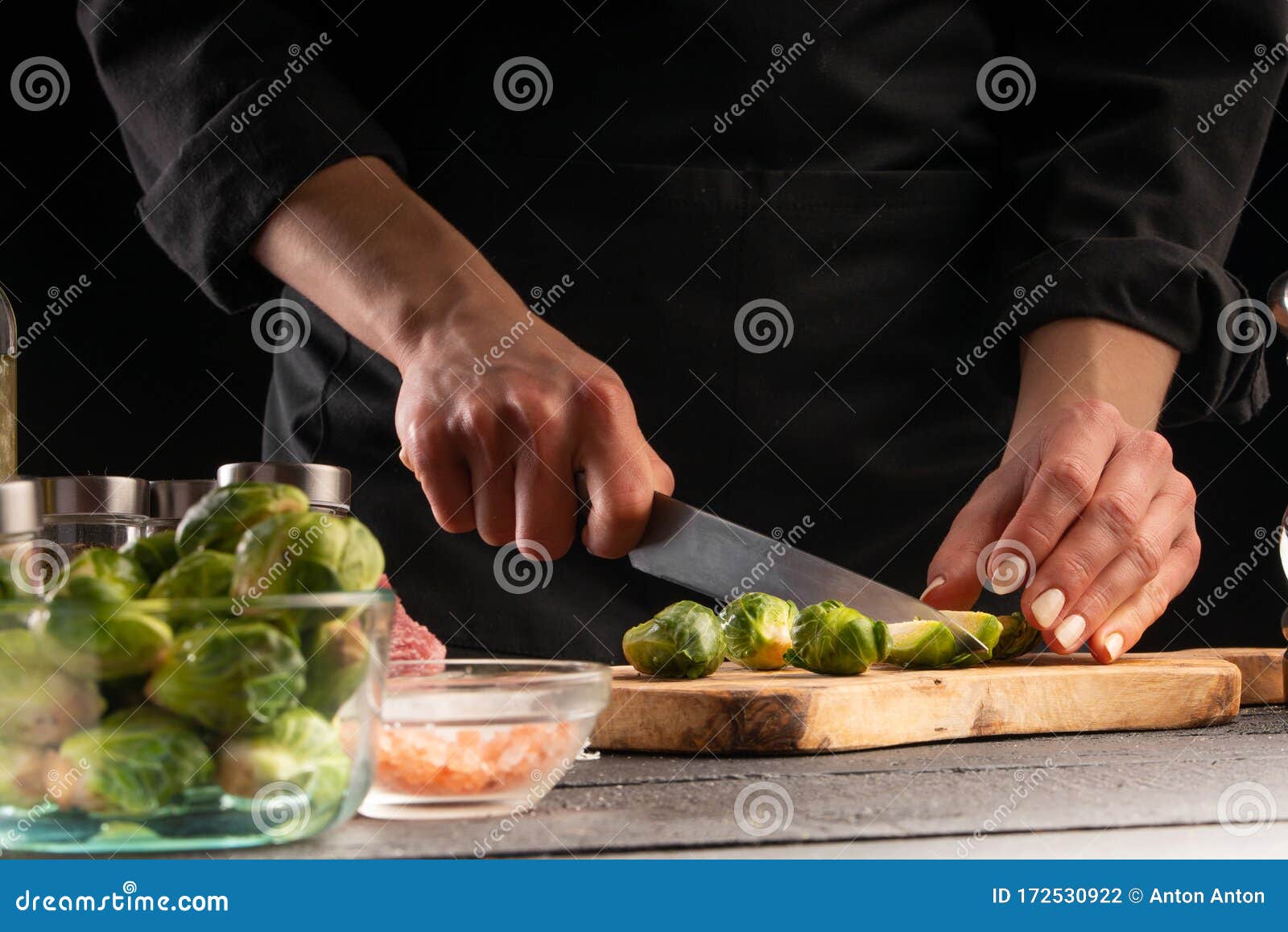 Cooking Salad Or Sauce By A Cook Cutting Brussels Sprouts On A Black Background Horizontal Photo Advertising Cooking Recipe Stock Photo Image Of Ingredients Cookery 172530922