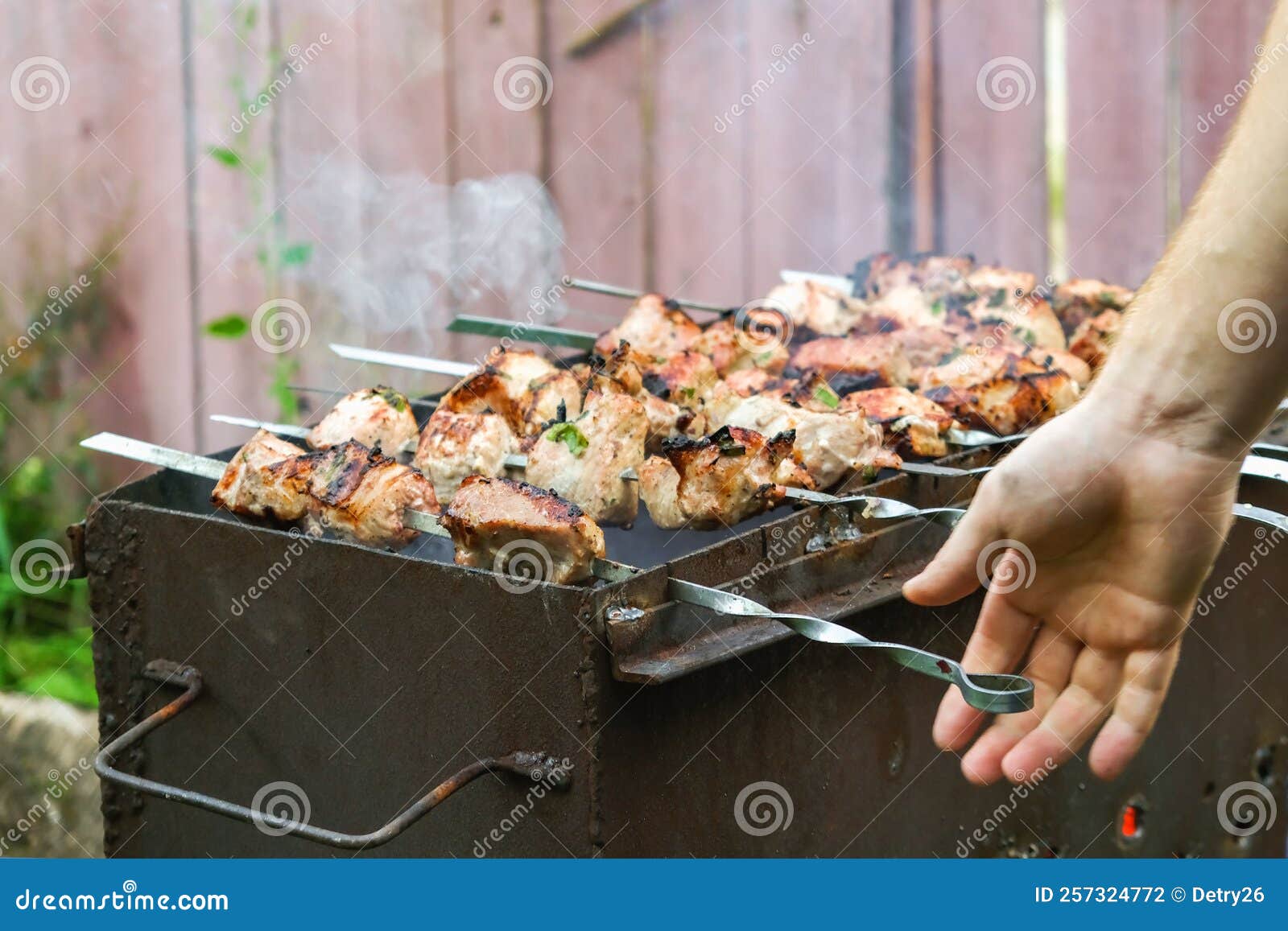 Cooking Shish Kebab the Grill. Cooking Marinated Meat on Coals. Cooking