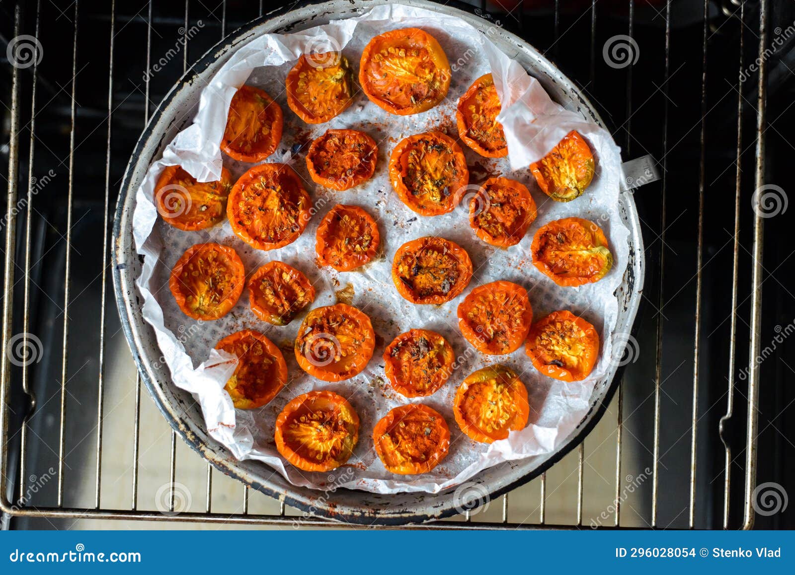 Cooking Sundried Tomatoes in the Oven in the Kitchen Stock Photo