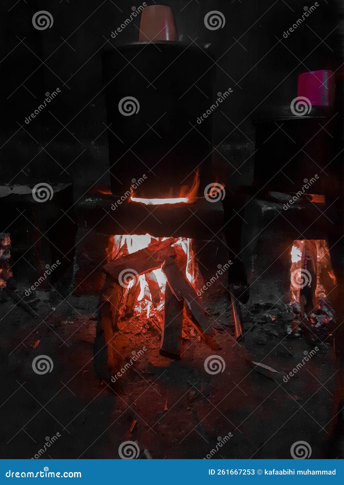 Cooking Water Using a Stove or You Can Call it an Ancient Stove Stock