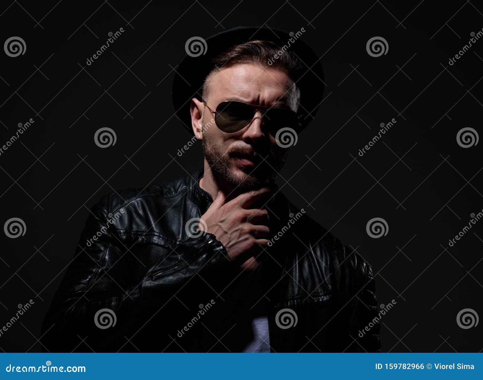 Cool Biker Wearing Leather Jacket, Hat And Sunglasses Stock Photo