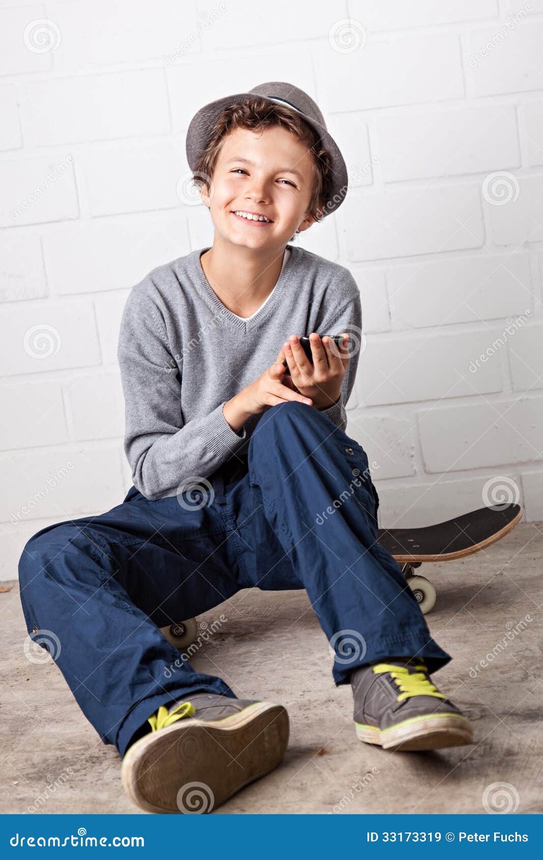 Cool Boy Sitting on His Skateboard, Laughing. Stock Image - Image of ...