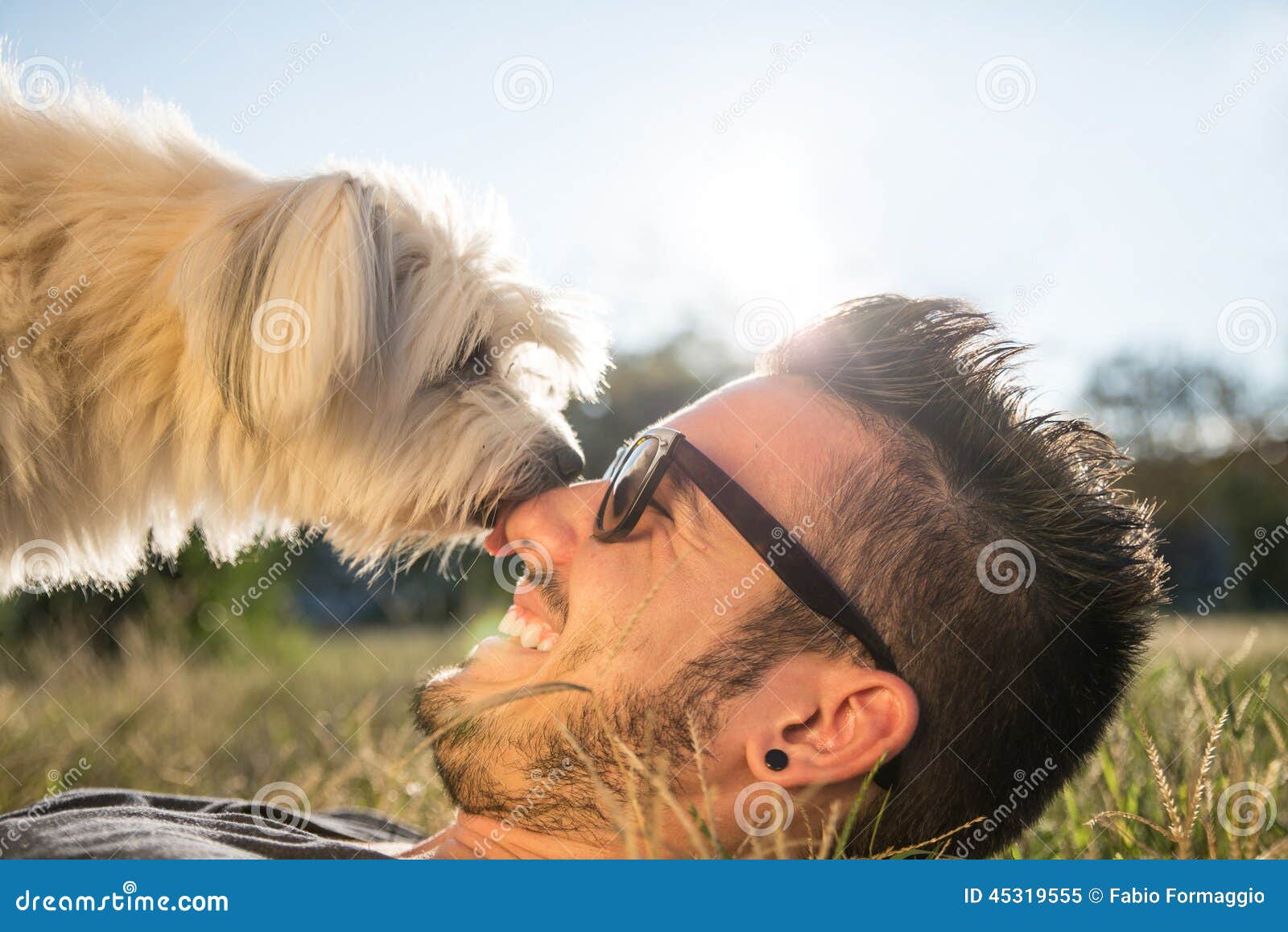 cool dog playing with his owner