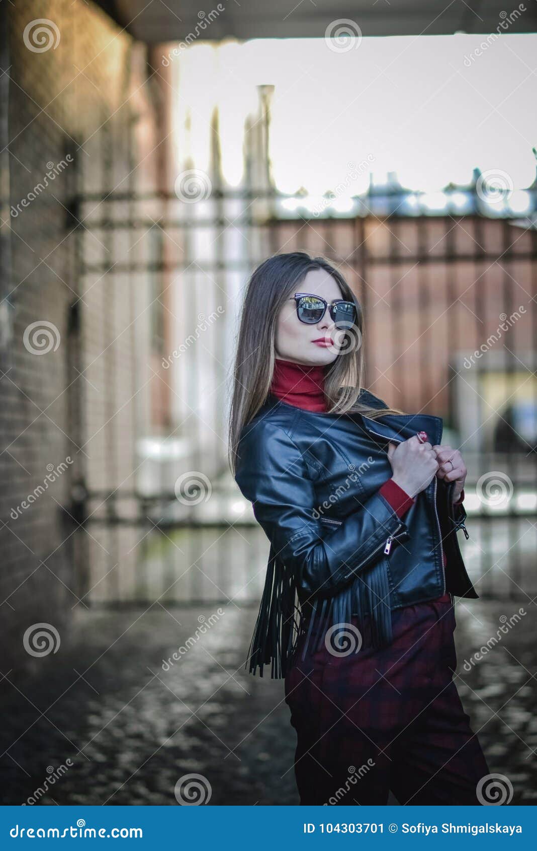 The Coolest Girl In The Black Leather Jacket And Sunglasses Walks 