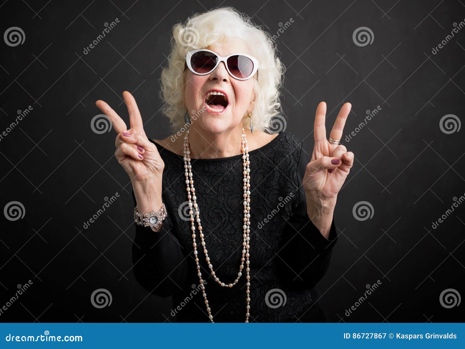 cool grandmother showing peace sign