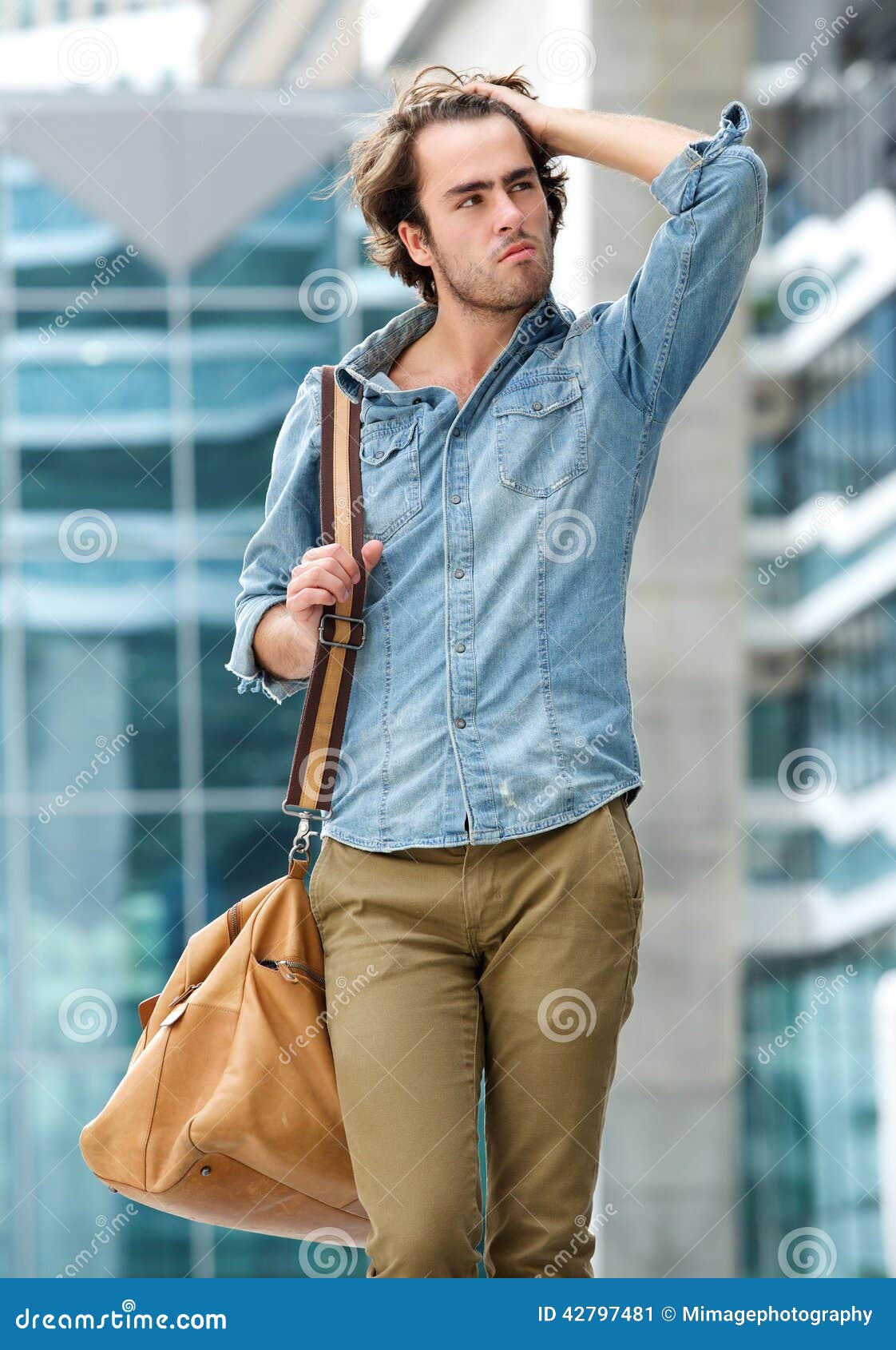 cool guy posing bag outdoors portrait 42797481