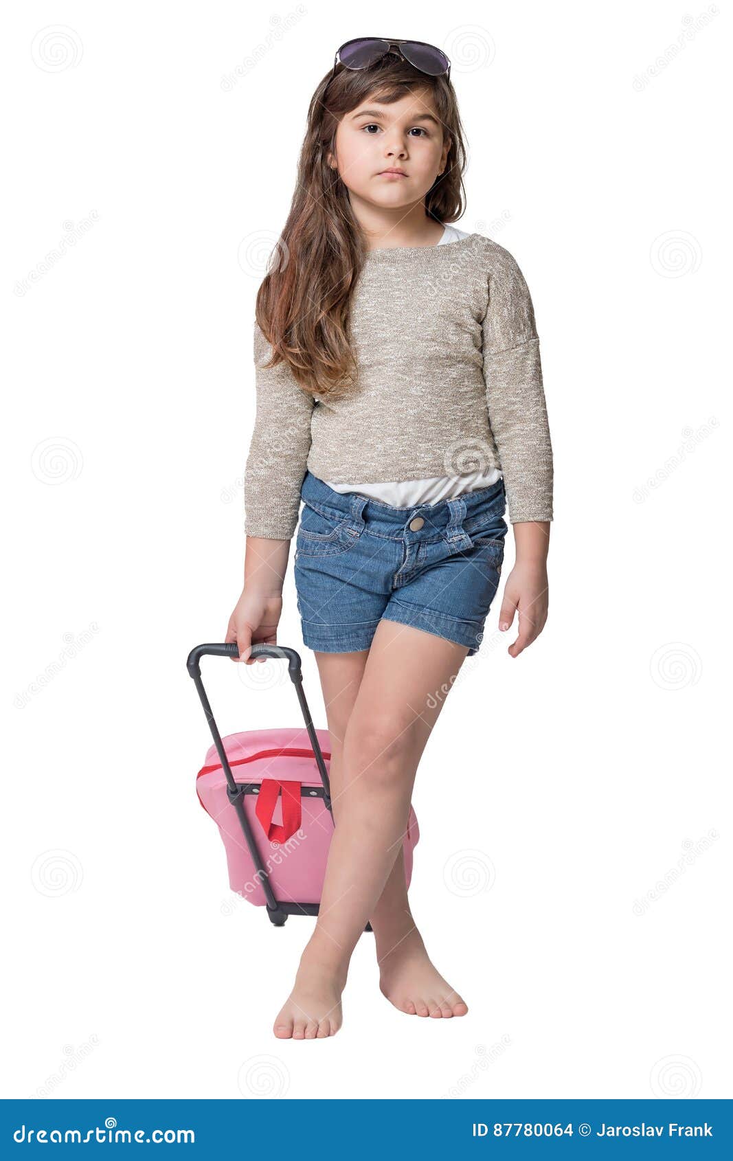 cool little girl holding baby pink suitcase