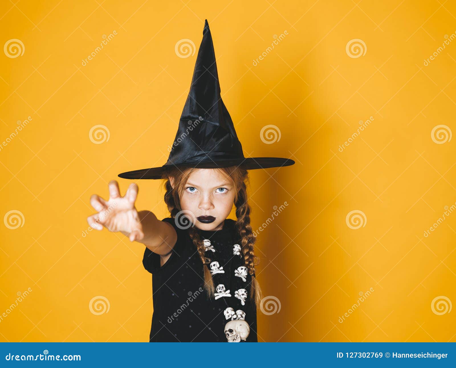Beautiful Young Halloween Witch on Orange Background with Black Hat ...