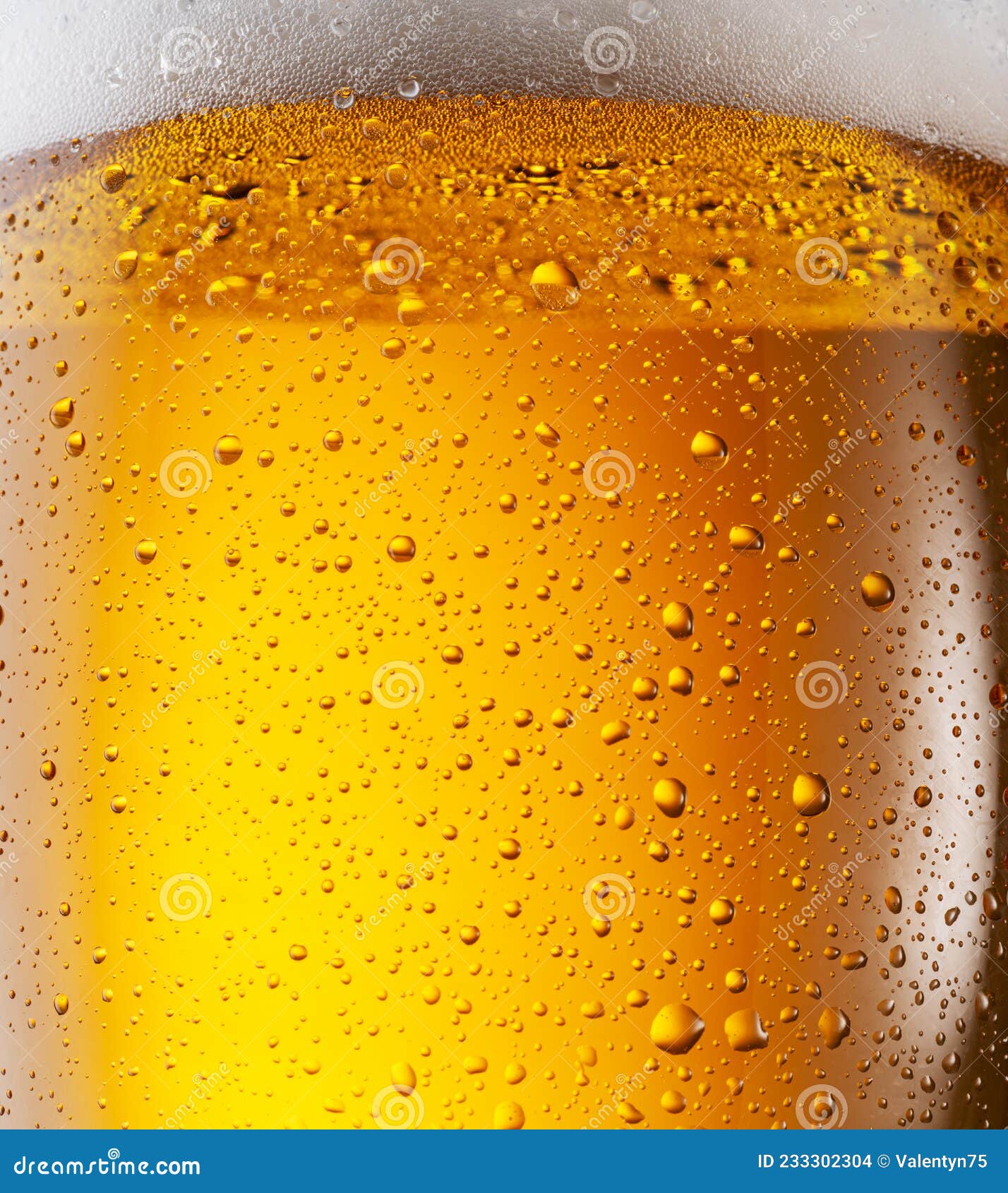 Cooled Glass of Beer Closeup. Small Water Drops on Cold Surface of