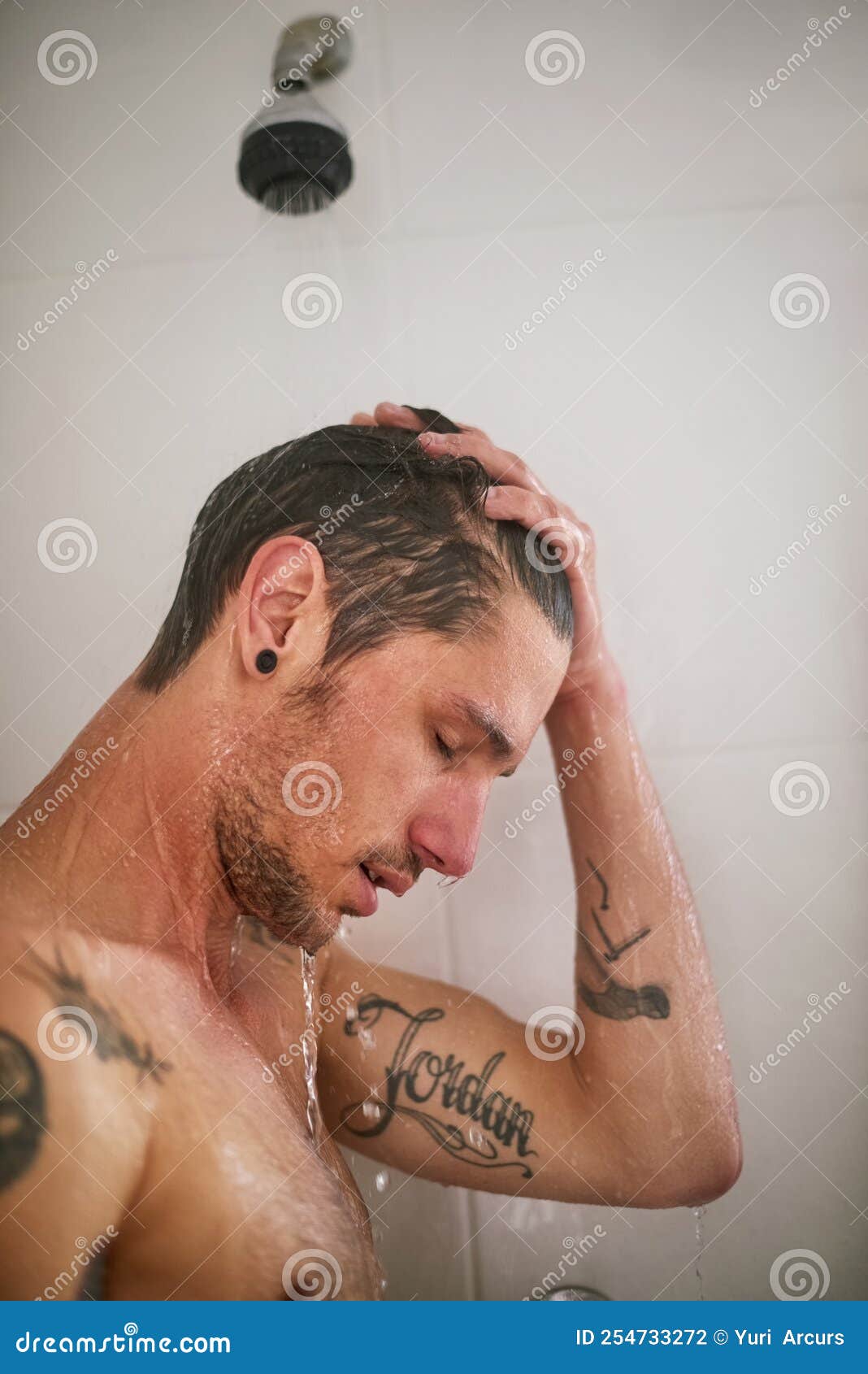 Cooling Off in the Shower. a Handsome Young Man Having a Shower. Stock
