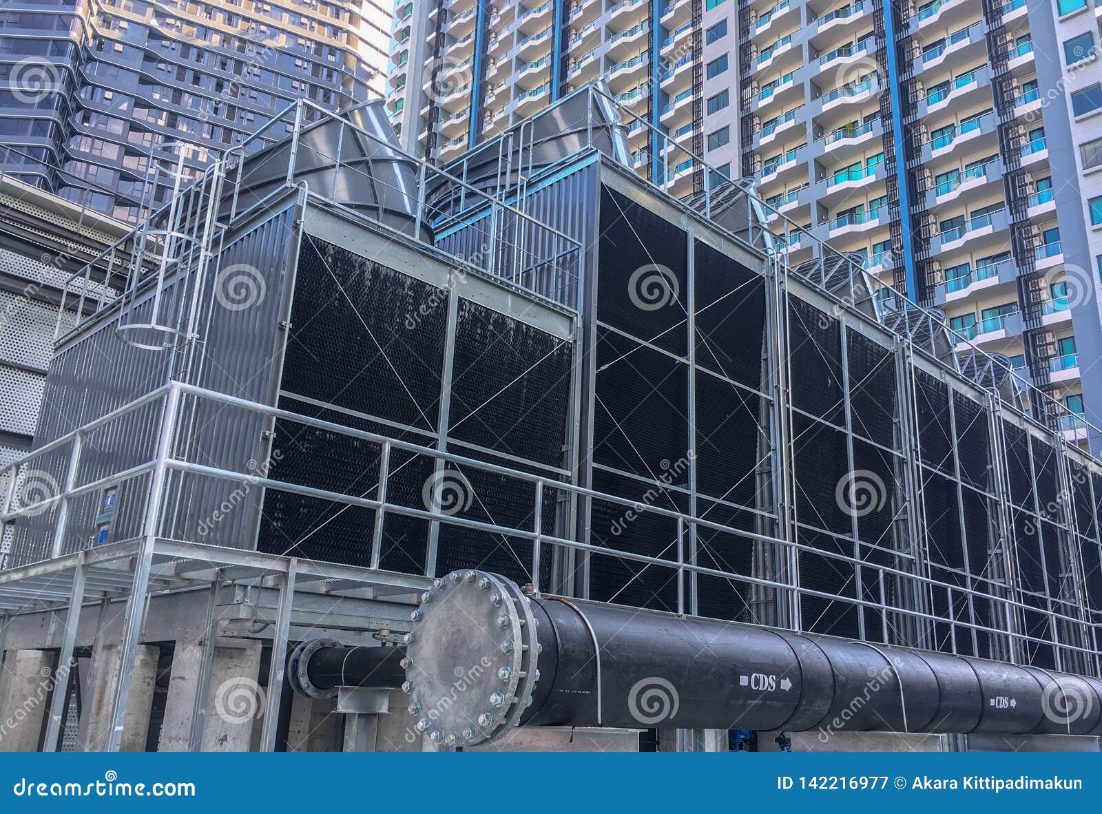 cooling towers with a pipe install on the rooftop of building