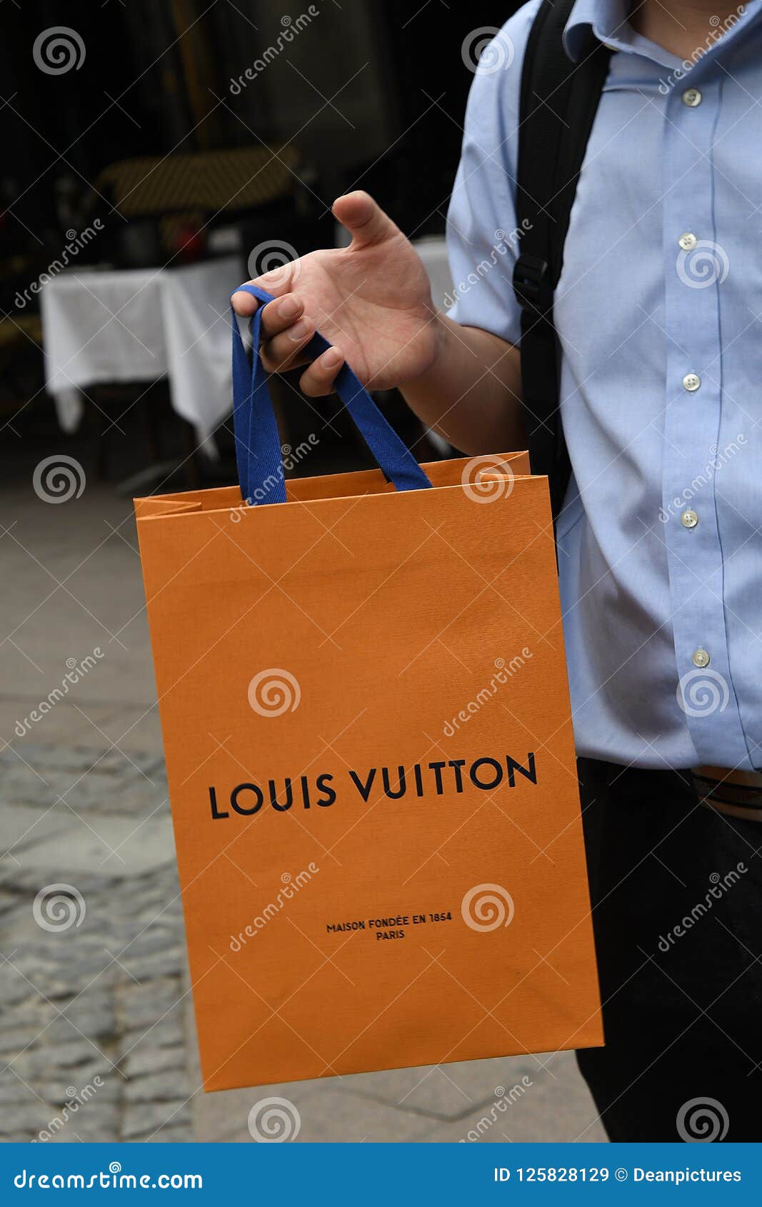 ASIAN LOUIS VUITTON SHOPPER with SHOPPING BAG Editorial Stock