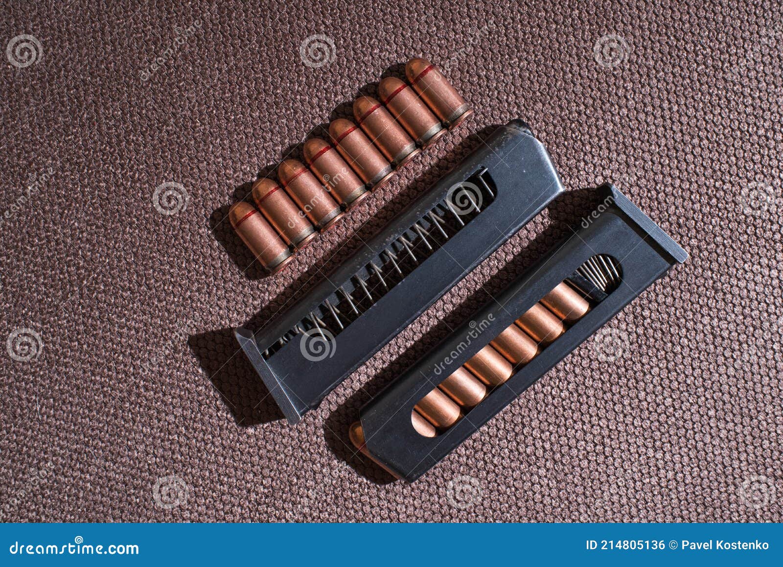 Copper Firearms Bullets and Pistol Clips. Weapon. Stock Photo Image