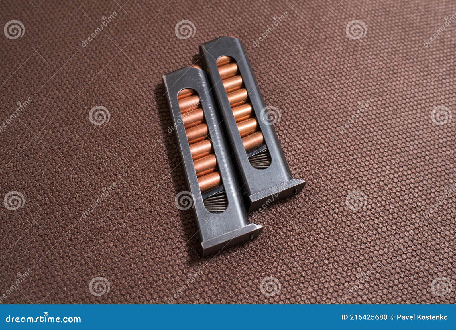 Copper Firearms Bullets and Pistol Clips. Weapon. Stock Photo Image
