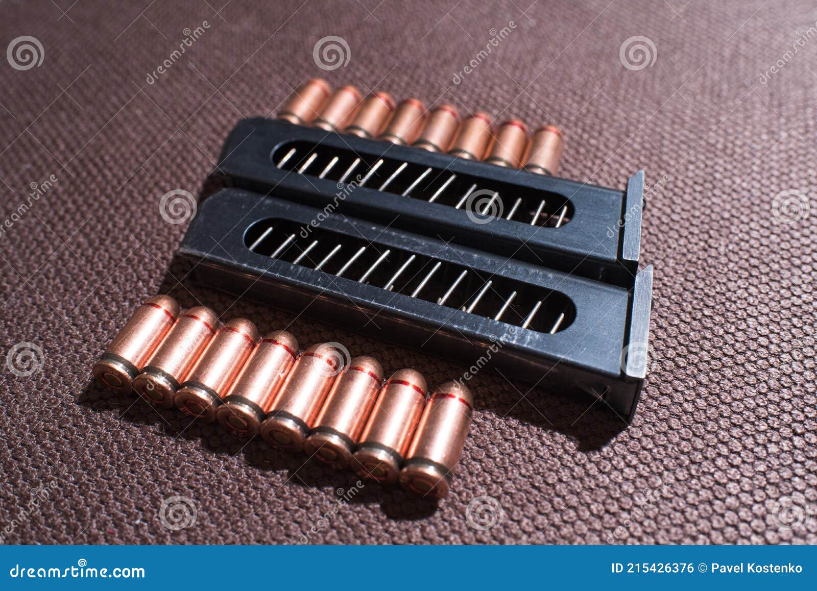 Copper Firearms Bullets and Pistol Clips. Weapon. Stock Photo Image