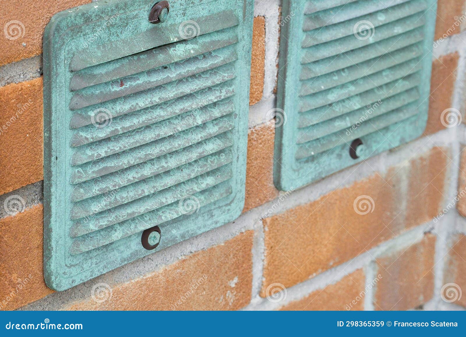 Copper Ventilation Grilles Against a Brick Wall Stock Image Image of