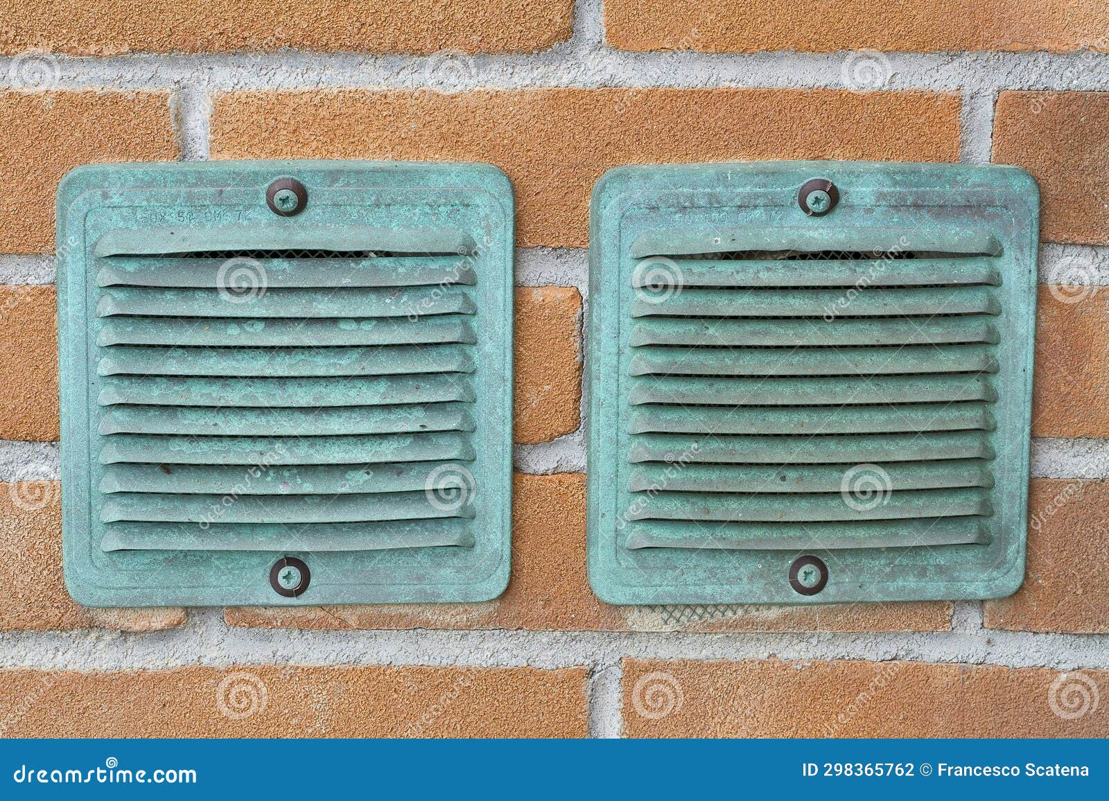 Copper Ventilation Grilles Against a Brick Wall Stock Photo Image of