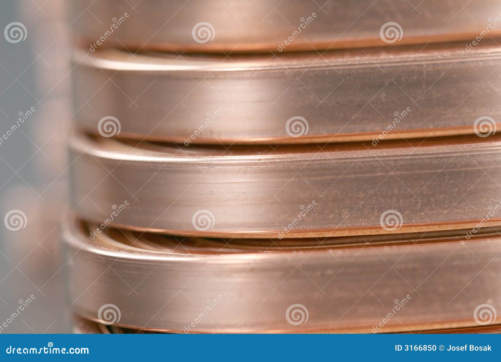 Copper Wire Spool. Red Insulated Wire Wound Up On Plastic Spindle. End