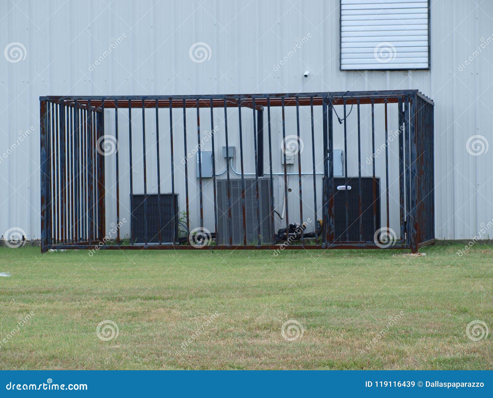 Copper Wire and Tube Protection. With the price of copper on the commodity markets rising and the theft of wireing and tubes being stripped from AC units, cages like this one have begun to appear from businesses to home owners. Note the camera also installed for security.