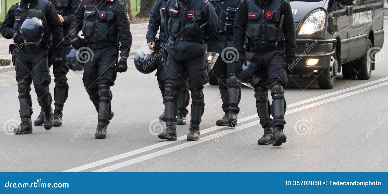 cops while marching together in the middle of the road