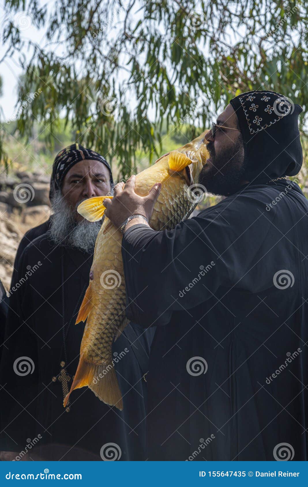 Coptic Monk At Tabgha Church Beside Sea Of Galilee Holding A Big Fish Editorial Image Image Of Landmark Christ 155647435