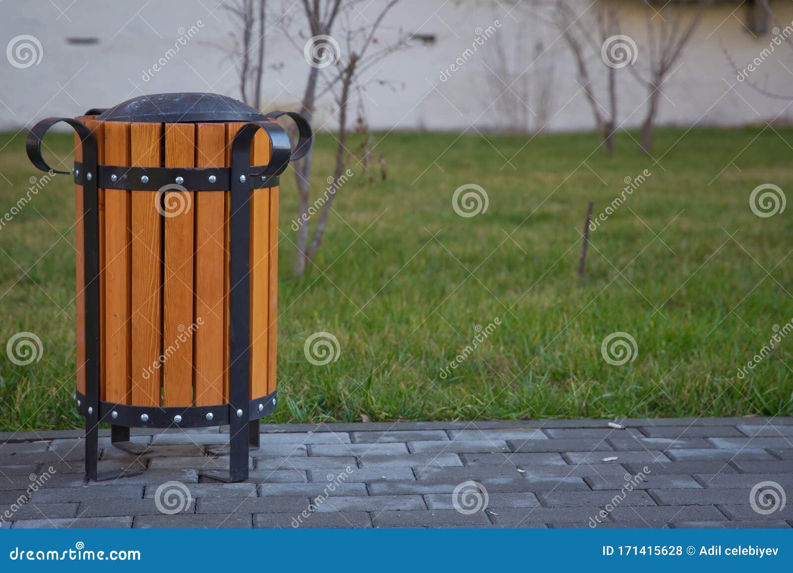 Copy Space on the Left. Rubbish Box in the Park . a Wooden Urn and a