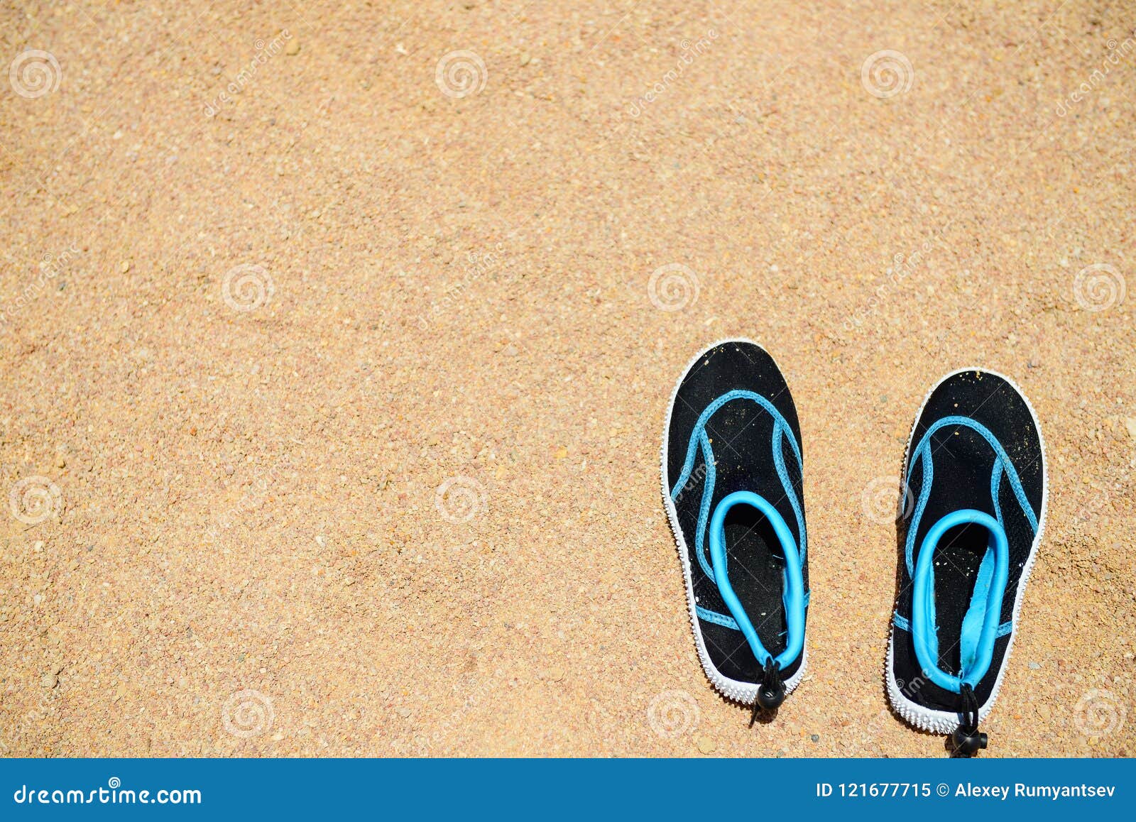 Coral shoes on sandy beach stock image 