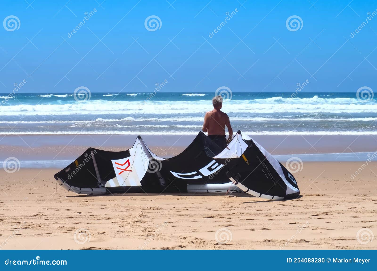 Core Kite Surfing Umbrella and Surfer at the Beach Editorial Image