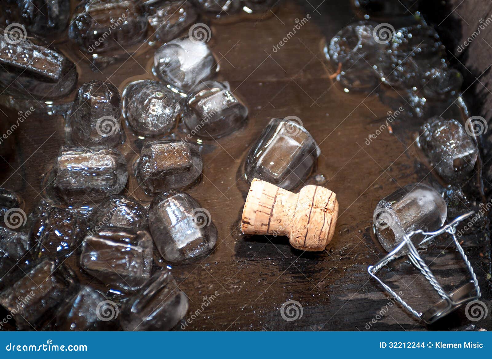 Cork of Champagne Bottle in Oak Barrel with Ice Cubes Stock Photo