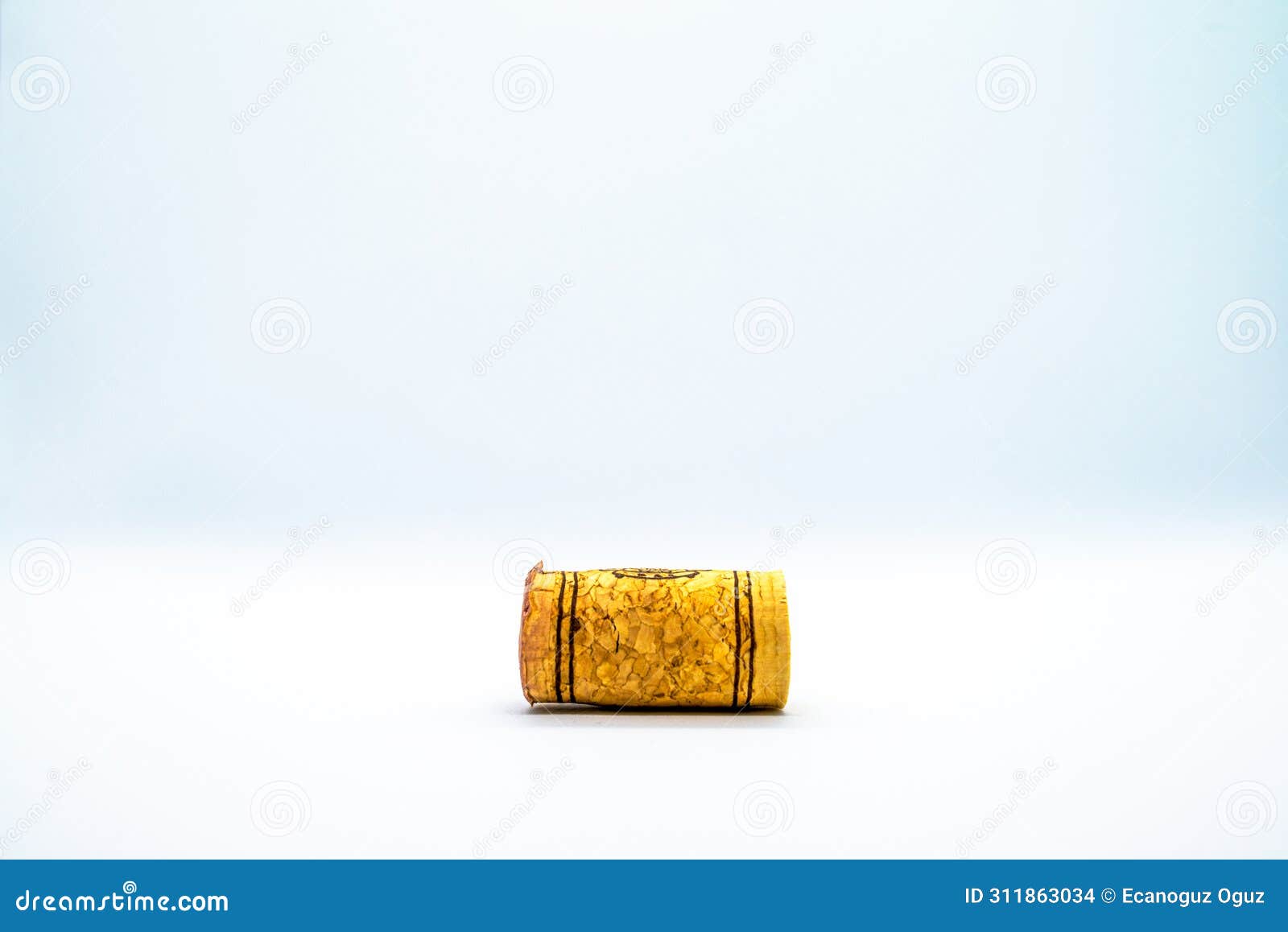 cork essence: winecork on white background