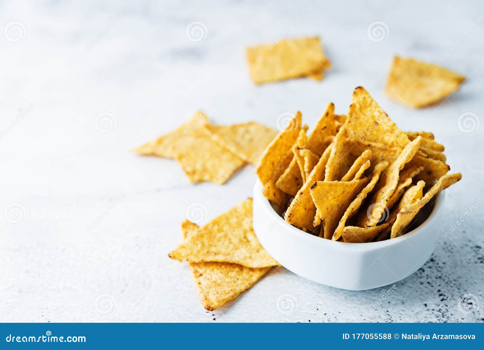Corn chips in a white bowl stock photo. Image of potato 177055588