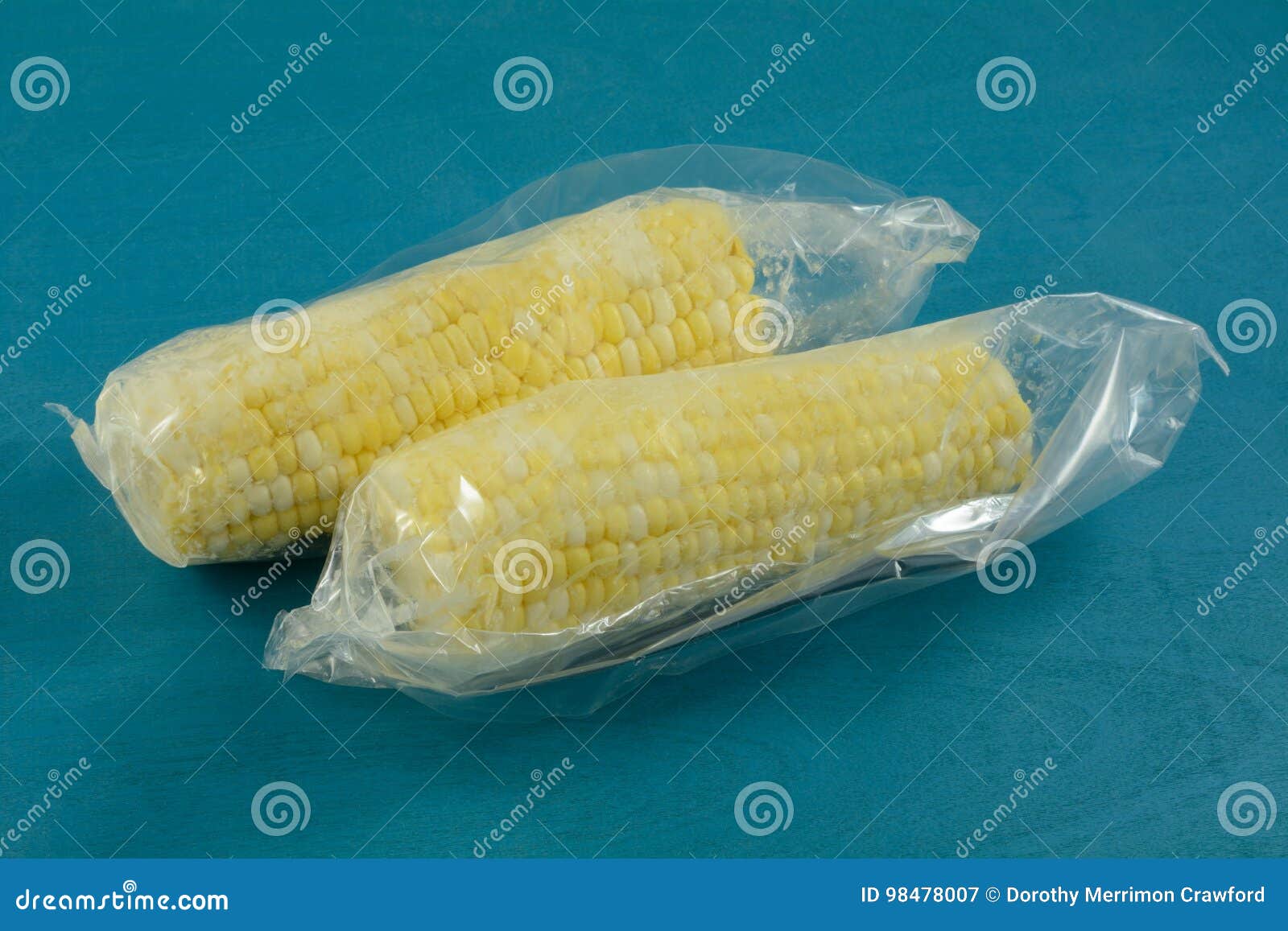 Corn on the cob in plastic stock image. Image of organic 98478007